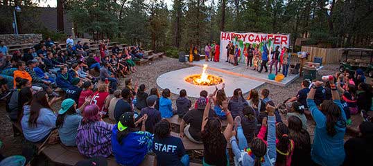 A firepit gathering at Salvation Army Sierra del Mar's Pine Summit Camp