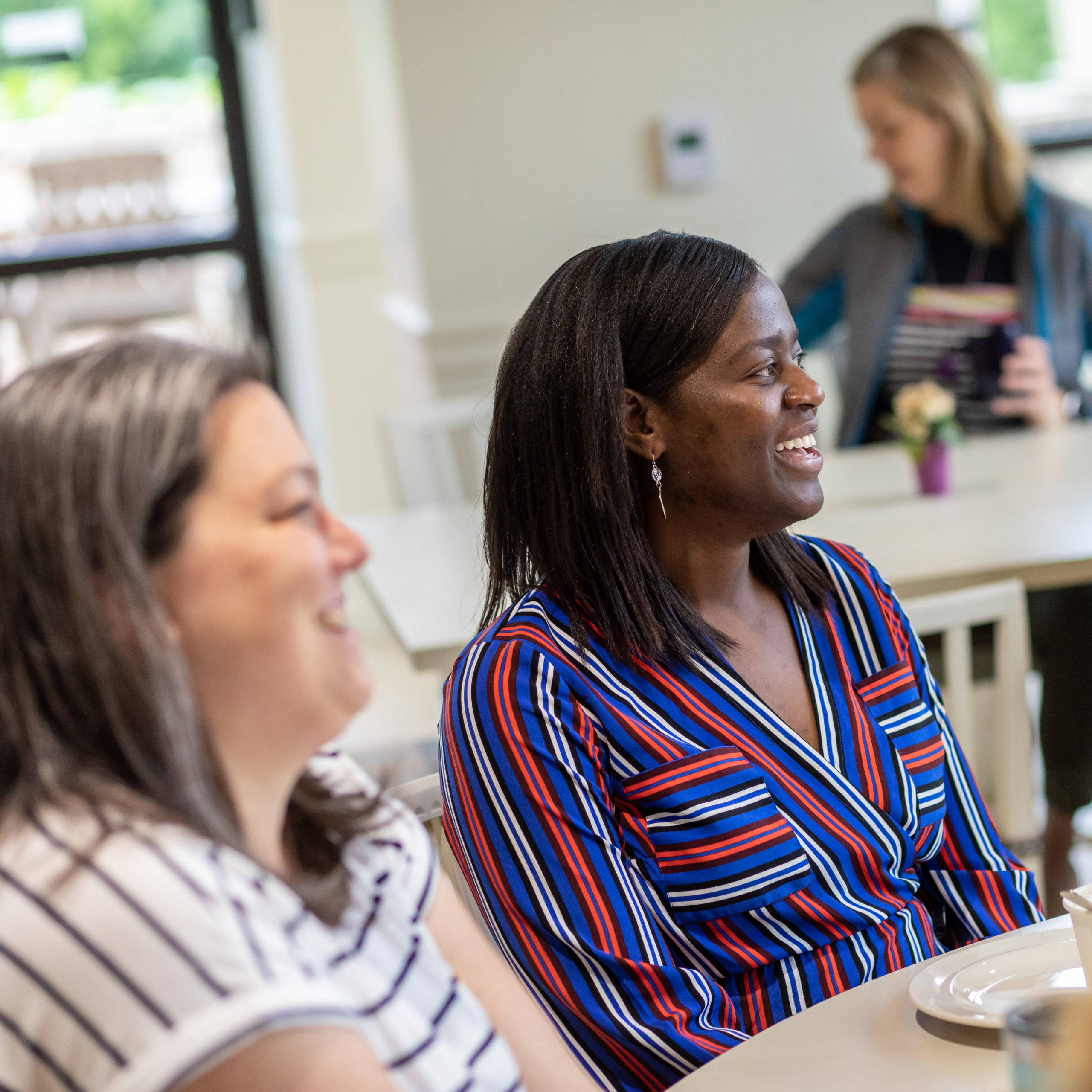 Two employees laughing together