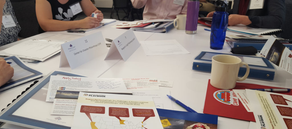 Materials on a table during a planning meeting of nonprofit organizations that respond to disasters in the Midwest