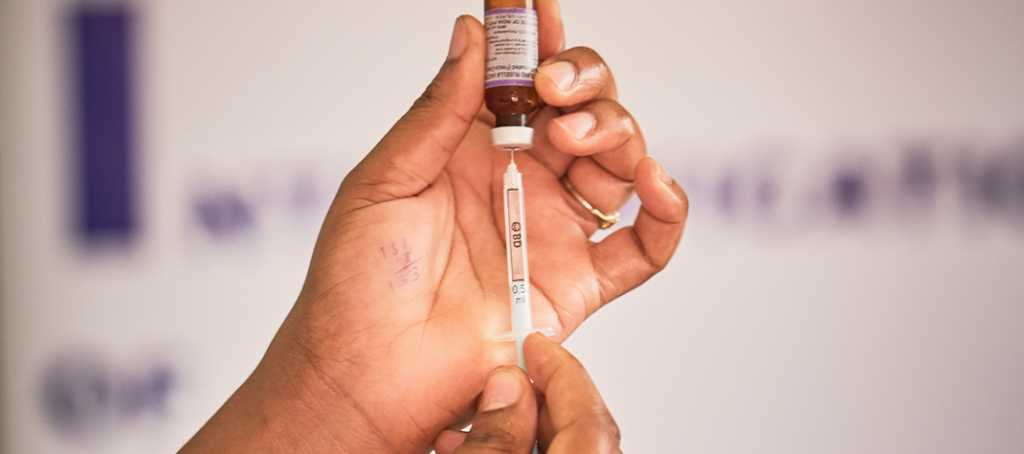 A health worker prepares to administer a measles-rubella vaccine in Nairobi, Kenya.